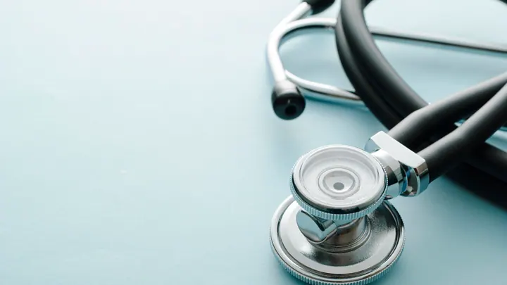 A coiled stethoscope photographed close up